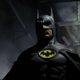Michael Keaton wears his black cowl and cape with the yellow and black Batman logo on his chest in Tim Burton's 1989 Batman movie.